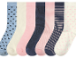 Six paires de chaussettes pour femmes, avec différents motifs et couleurs pastel.