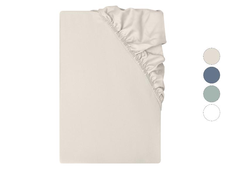 Drap-housse beige avec coins élastiques et choix de couleurs à droite