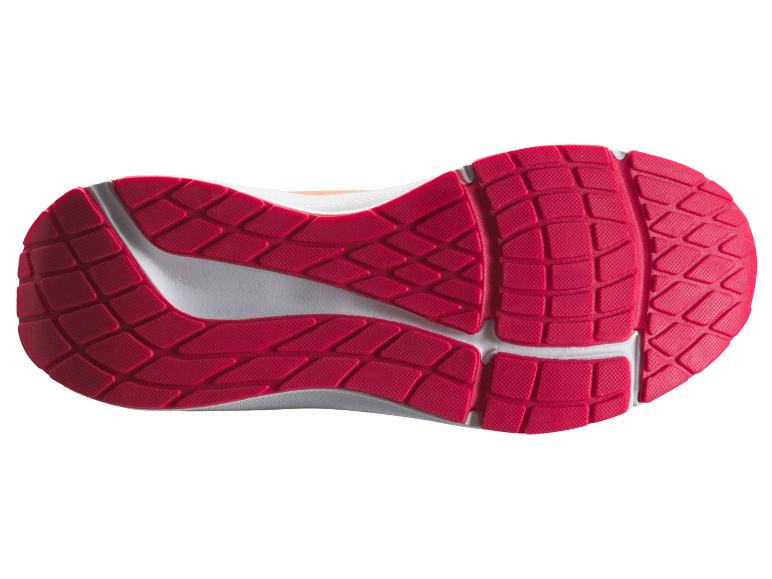 Semelle de chaussure de sport avec motif de crampons rouges et détails blancs.