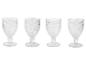 Quatre verres à pied en verre transparent, décorés de motifs gravés.