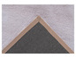 Détail d'un tapis blanc avec une bordure brune
