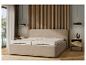 Un lit beige avec un matelas dans une chambre à coucher moderne.