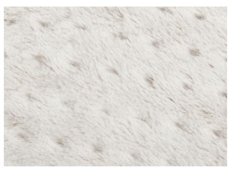 Texture de fausse fourrure blanche avec des taches marron clair