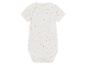 Un body bébé blanc à pois jaunes, roses et bleus.