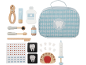 Kit de dentiste jouet en bois avec outils, dentifrice, bain de bouche, radiographies et sac bleu à motifs.