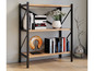 Une étagère en bois avec des pieds en métal noir, remplie de livres et de décorations.