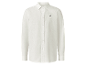 Chemise en lin blanc brodée d'un cavalier.