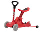 Une trottinette Playtive rouge avec un siège et un guidon.