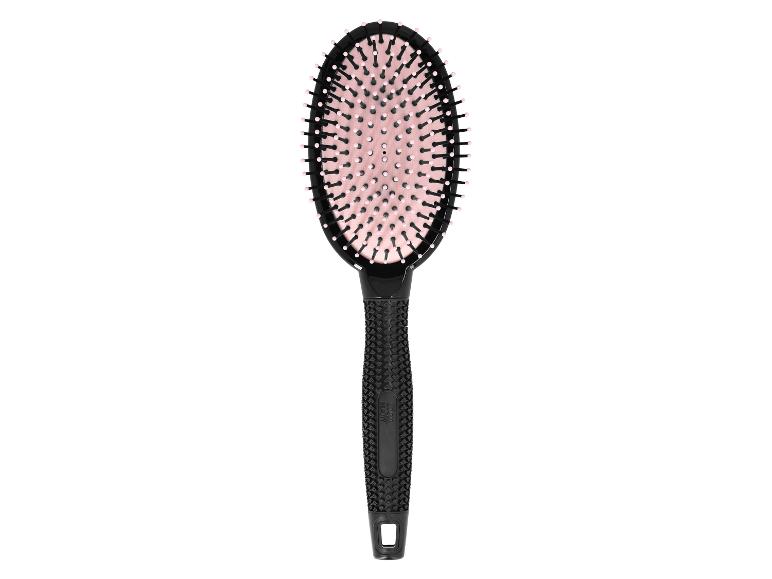Brosse à cheveux ovale noire avec poils roses et manche texturé