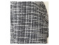 Gros plan sur un tissu tweed noir et blanc.