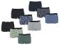 Un assortiment de boxers en coton de différentes couleurs et motifs, y compris des ananas et des voitures.