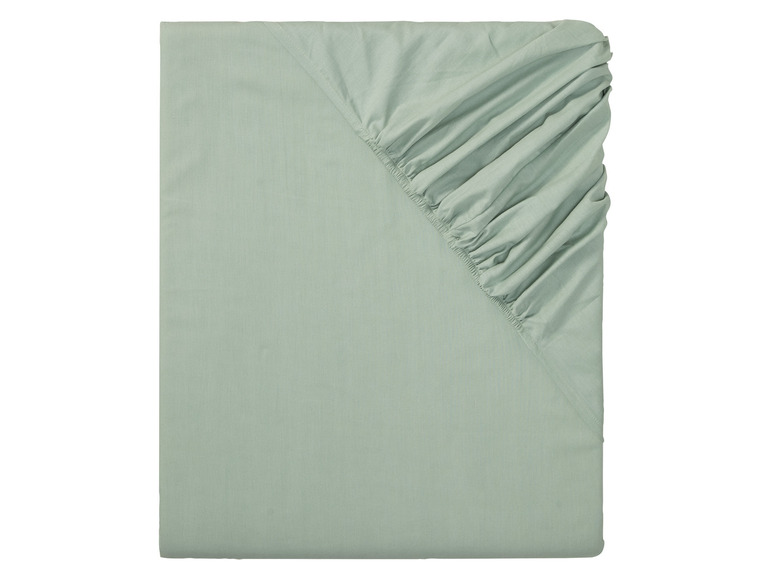 Un drap-housse de couleur vert clair.