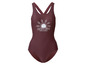 Un maillot de bain bordeaux avec un imprimé soleil et l'inscription 'Wild at heart'.