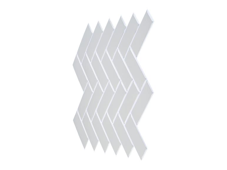 Carreaux autocollants blancs à motif chevrons sur fond blanc.