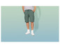 Un homme portant un short cargo vert et des baskets blanches.