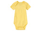 Un body bébé jaune à manches courtes.