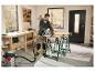 Tréteau réglable en hauteur PARKSIDE® utilisé pour scier du bois dans un atelier