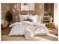 Parure de lit en flanelle fine LIVARNO® à motif floral dans une chambre chaleureuse.