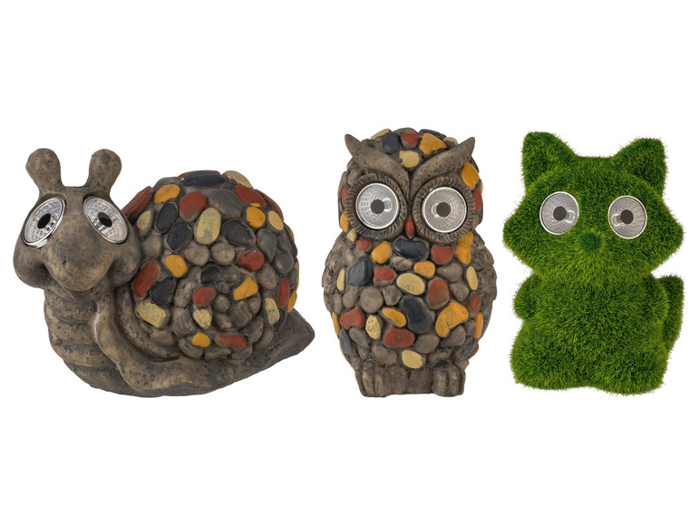 Un escargot, un hibou et un chat en pierre avec des lumières solaires.