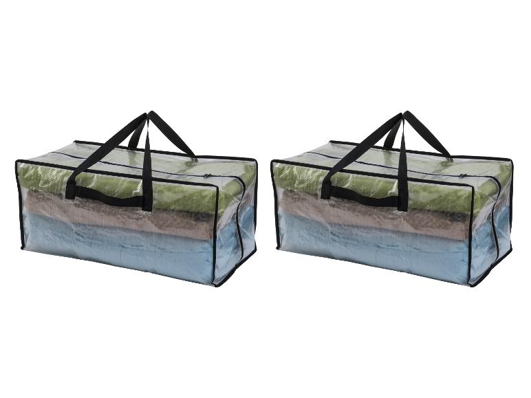 Deux sacs de rangement transparents avec des couvertures pliées à l'intérieur.