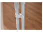 Deux tubes métalliques blancs fixés ensemble par un collier en plastique.