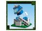 Modèle Lego Minecraft montrant un bloc bleu tombant sur une base grise et verte.