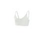 Crop top de sport femme blanc cassé, avec fines bretelles réglables.