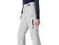 Pantalon de ski gris clair avec fermeture éclair latérale noire, porté par une personne en haut bleu foncé.