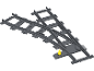 Aiguillage de train miniature en plastique gris avec un levier jaune.