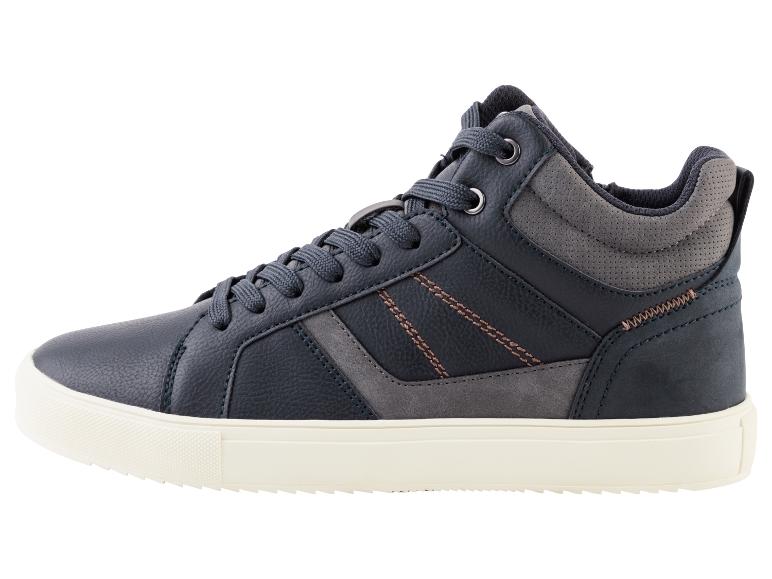 Une chaussure de sport bleu foncé avec une semelle blanche.