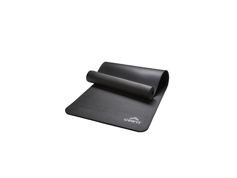 Tapis de yoga noir Crivit, partiellement roulé, avec texture côtelée