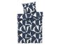 Parure de lit bleu marine et blanc à motifs géométriques abstraits.