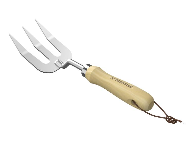 Un outil de jardin Parkside avec une poignée en bois et un trident.