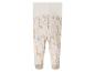 Pantalon bébé blanc avec motif de girafes.
