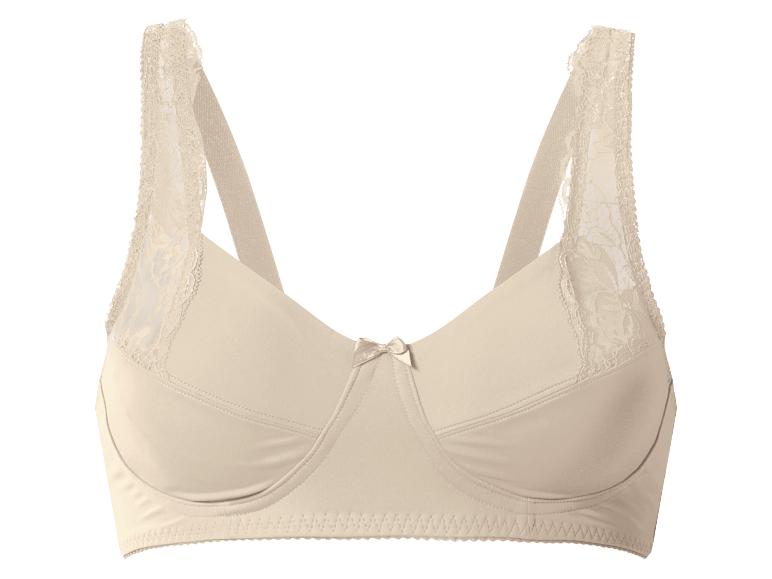 Soutien-gorge beige avec détails en dentelle sur les bretelles et un petit nœud central.