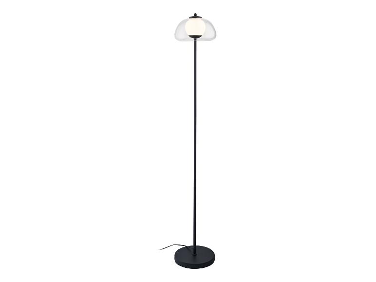 Lampadaire moderne avec abat-jour en verre transparent.