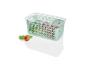 Une boîte de rangement en plastique verte avec un couvercle, remplie de fruits.