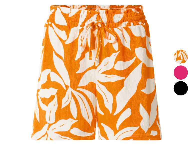 Shorts femme à imprimé feuilles orange et blanc, taille élastique et cordon de serrage.