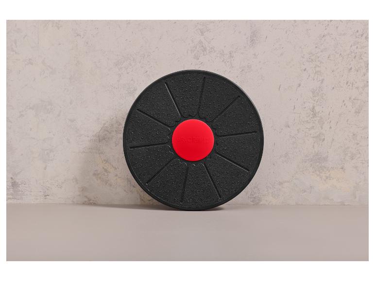 Un disque de fitness noir avec le logo CRIVIT rouge.