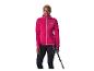 Femme en veste polaire rose et legging noir avec bâtons de randonnée.