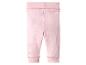 Legging bébé rose avec une large taille côtelée et des poignets côtelés