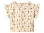 Haut bébé beige clair à motif floral rouge et manches à volants.