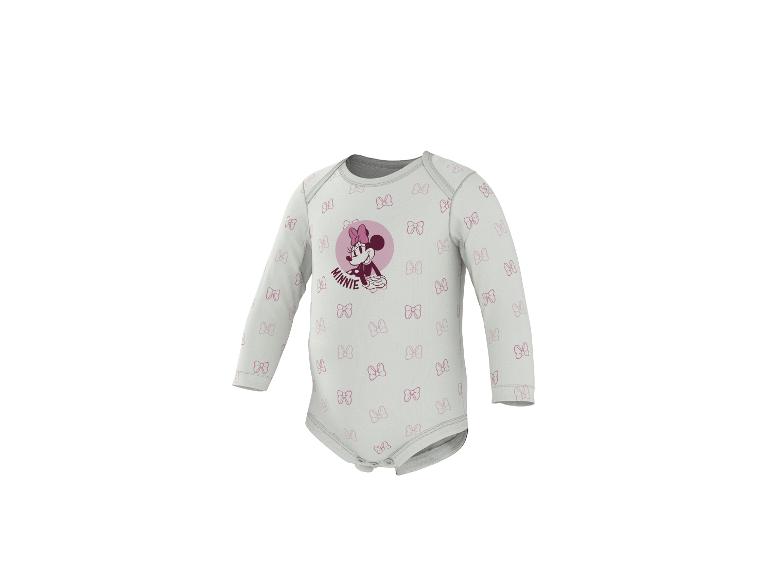 Body bébé blanc à manches longues avec motif Minnie Mouse et nœuds roses.