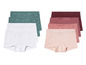 Un ensemble de sous-vêtements avec des culottes blanches, vertes et roses.