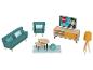 Canapé, fauteuil, table basse, meuble TV et lampe dans le salon.