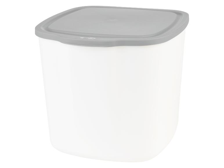 Une boîte de rangement blanche avec un couvercle gris.