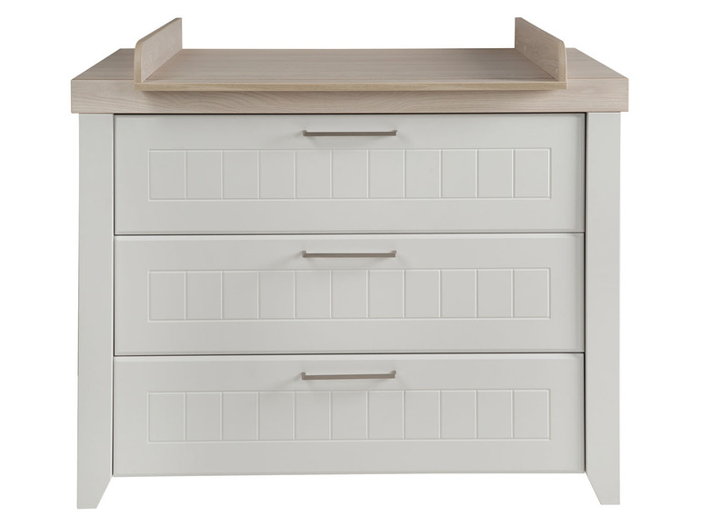 Commode blanche avec trois tiroirs et plan à langer.