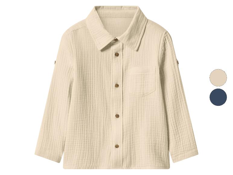 Chemise en mousseline crème à manches longues avec boutons marron et poche, avec options de couleur.