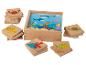 Blocs en bois avec des images d'animaux marins, y compris des crabes, des poissons et des tortues.