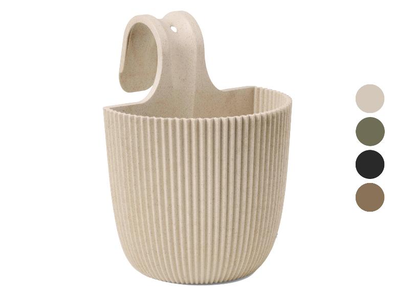 Panier suspendu beige avec texture côtelée et options de couleur.